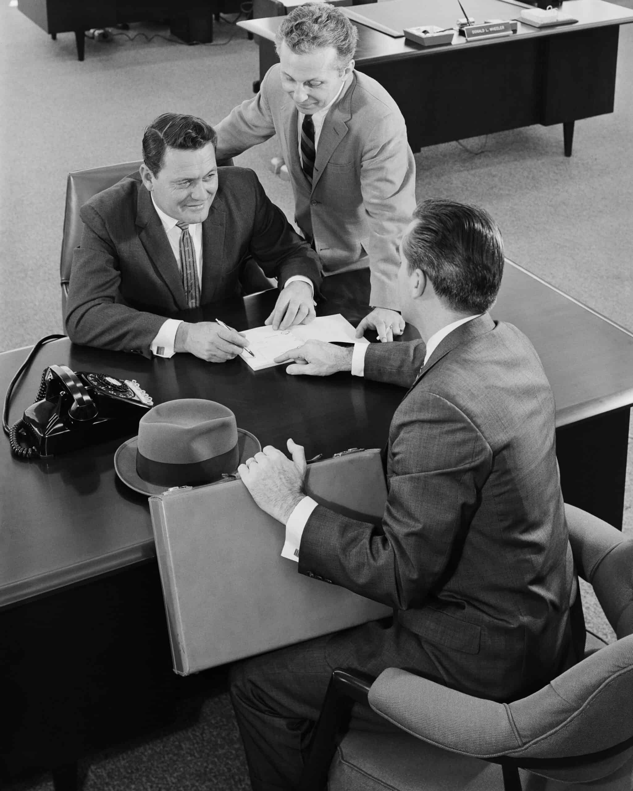Business professionals discussing marketing strategies in a modern office.